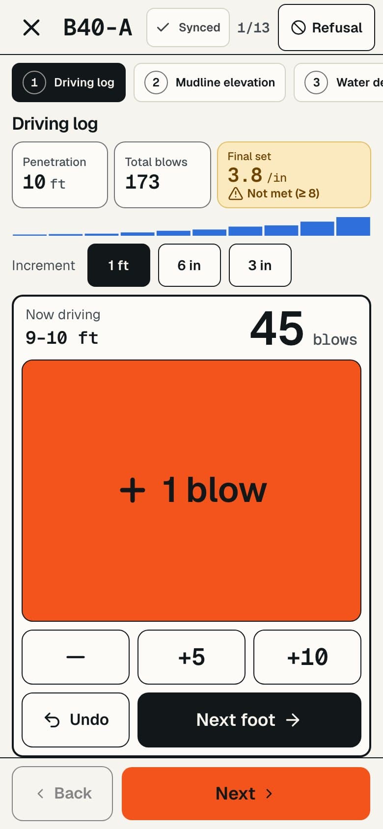 The driving log on a phone, with a button for each foot of penetration and a refusal hint.